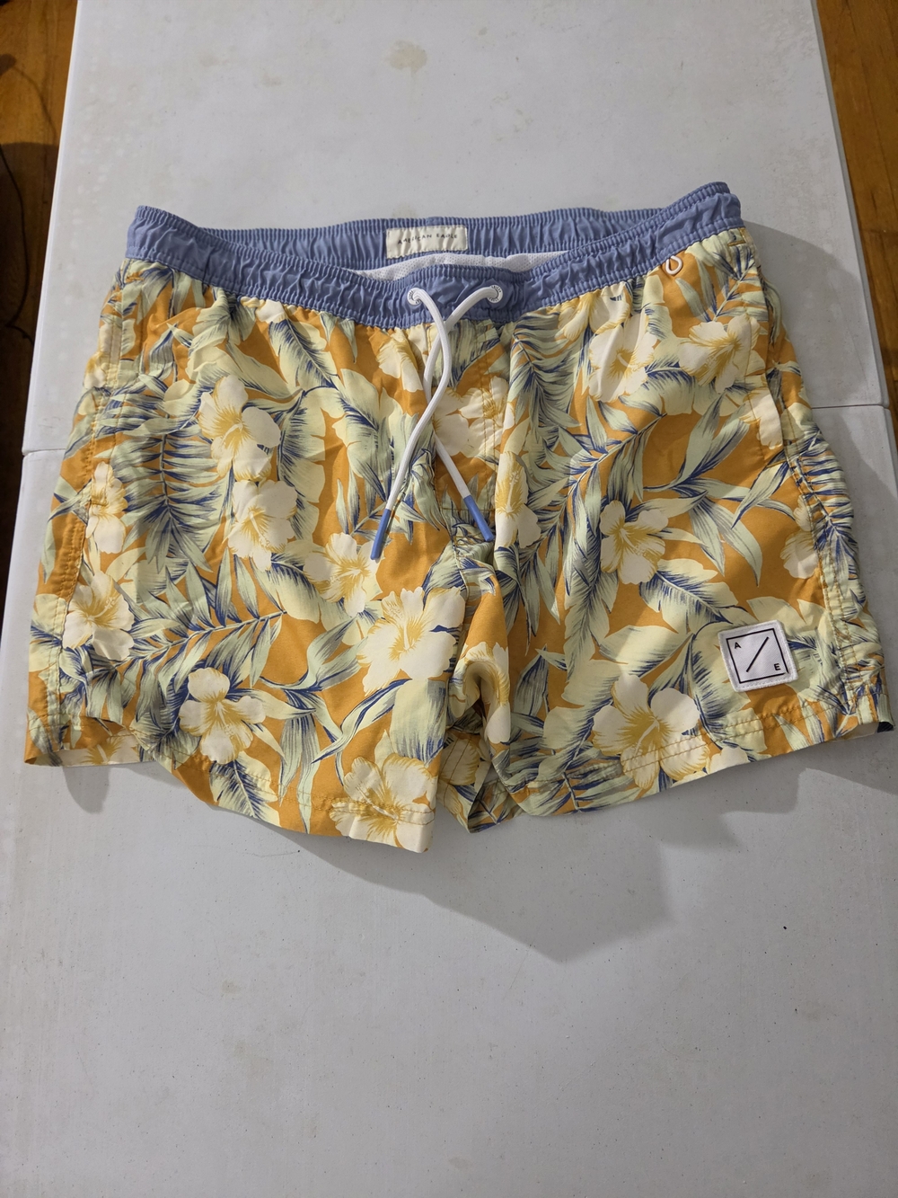 American Eagle Outfitters Yellow Floral Swim Trunks with Blue Waistband